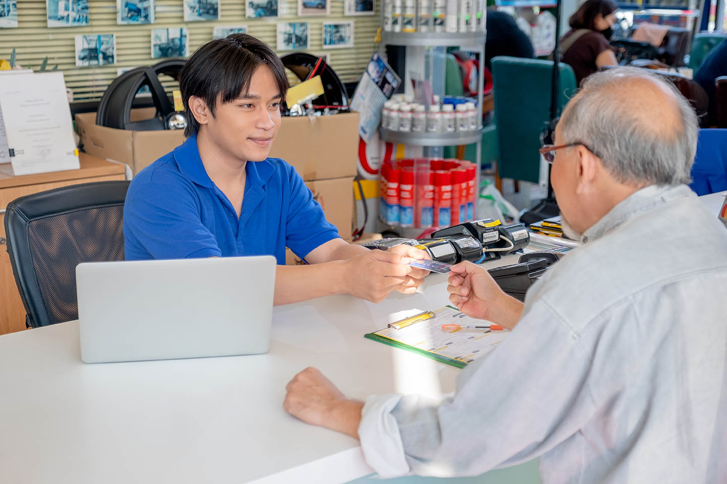 Customer service Asian worker or staff at office counter area re